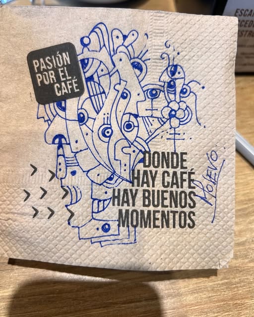 Blue ink drawing on a café napkin